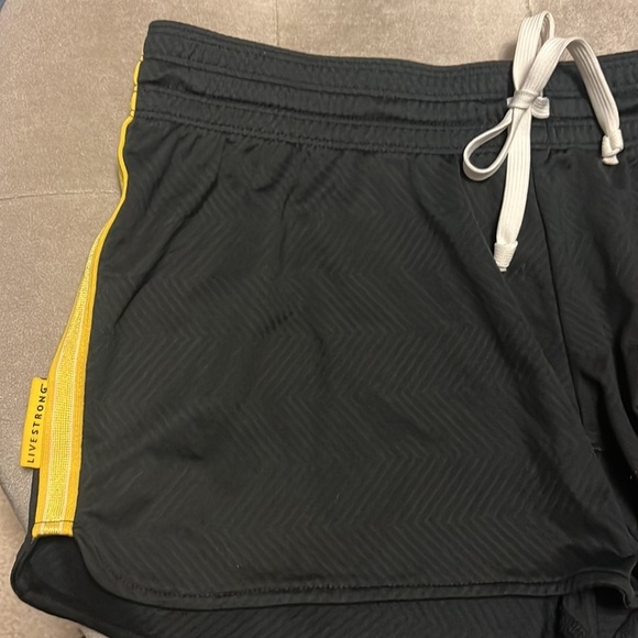 Nike dry fit shorts in black and gold. Live strong logo. - Picture 3 of 10